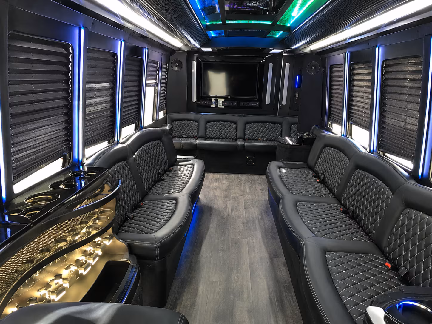 Friends laughing during a party bus celebration in New Orleans