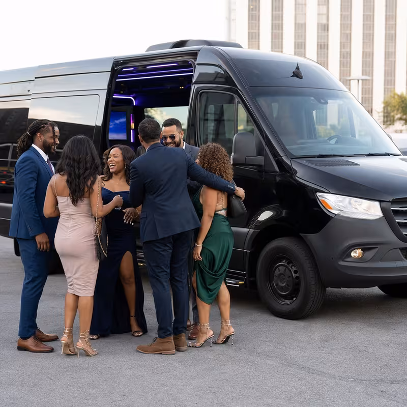 Passengers loading luggage while boarding an New Orleans group shuttle