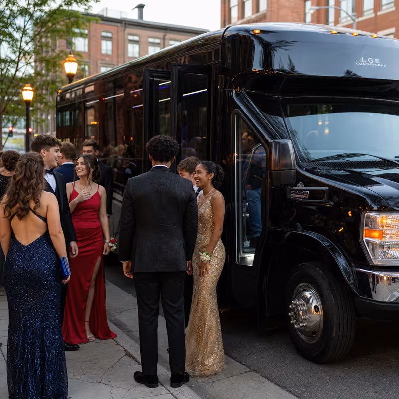 Passengers loading luggage while boarding an New Orleans group shuttle