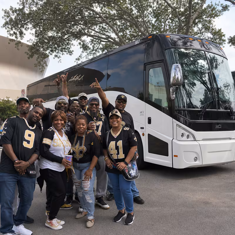 Passengers loading luggage while boarding an New Orleans group shuttle